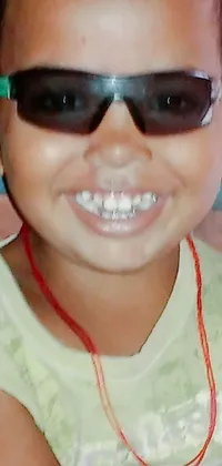 Get this fun and quirky phone live wallpaper featuring a close-up of a child wearing sunglasses designed in Toyism style