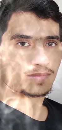 This live wallpaper features a close-up headshot of a person wearing a black shirt