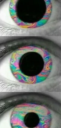 This stunning live wallpaper features a close-up view of three colorful eyes in a psychedelic, Tumblr-inspired style
