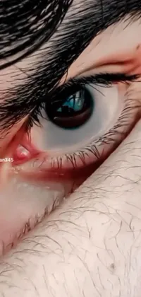 This phone live wallpaper features a dramatic close-up of an eye with long black hair in the art style of photorealism