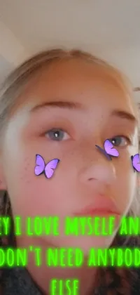 This phone live wallpaper features a young teenager with purple butterflies resting on her closed eyes