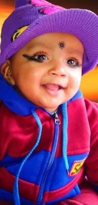 This charming phone live wallpaper features a cute baby wearing a purple hat and a joyful expression