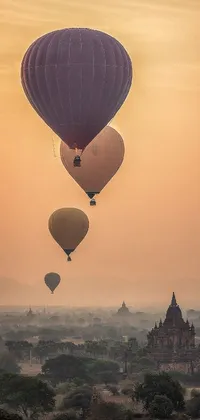 Bring your phone screen to life with this exquisite live wallpaper depicting a mesmerizing view of the beige mist-covered sky in Myanmar