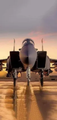 This stunning live phone wallpaper depicts a fighter jet ready for takeoff on an airport runway