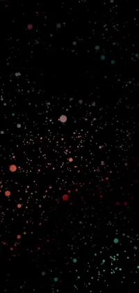 This live wallpaper for your phone features a sleek black background adorned with red, green, and blue dots forming captivating digital art