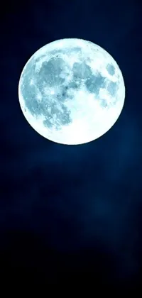 This stunning phone live wallpaper showcases a full moon illuminating the night sky with dramatic white and blue lighting