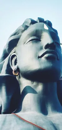 This live phone wallpaper features a stunning statue of a woman in a meditative state known as samikshavad