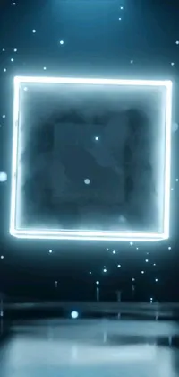 This phone live wallpaper features a glowing square hologram in a dark room emitting a cyan mist