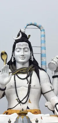 Enhance your phone's home screen with this stunning live wallpaper featuring Lord Shiva, a revered Hindu deity