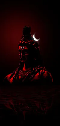 This live wallpaper for your phone features a stunning close-up of a person set against a background of a luminous moon and a detailed statue of God Shiva the Destroyer