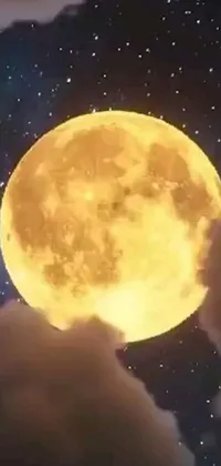 Looking for a stunning live wallpaper for your phone? Check out this digital art image of a yellowish full moon in the sky, which is still from a music video and trending on reddit