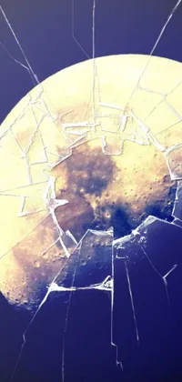 Experience the mesmerizing beauty of a shattered helmet and its intricate web of cracks in this stunning live wallpaper for your phone