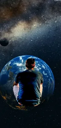 This space-themed live wallpaper showcases an unnamed figure seated atop a small planet against a stunning galaxy background