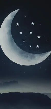 This phone live wallpaper showcases a beautiful night sky with a crescent moon and plenty of stars