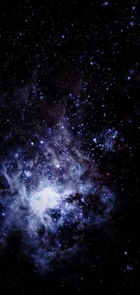 This live wallpaper features a stunningly dark sky filled with twinkling stars, a blue nebula, and realistic white clouds gently floating by