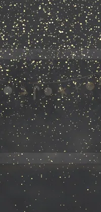 This live wallpaper features a modern clock on a window sill with glittering stars and a gold and black color scheme