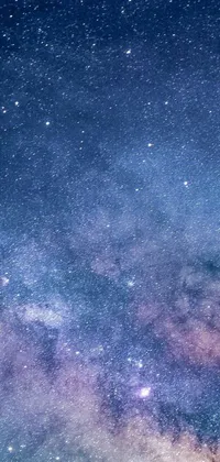 Transform your phone background with our stunning live wallpaper featuring a captivating galaxy night sky