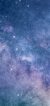Looking for a mesmerizing live wallpaper to decorate your phone screen? Look no further than this stunning night sky scene filled with countless twinkling stars