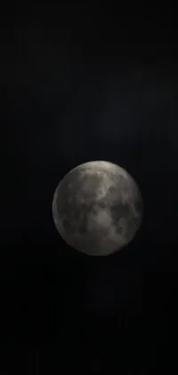 This <a href="/">phone live wallpaper</a> showcases a mesmerizing full moon that illuminates a dark sky