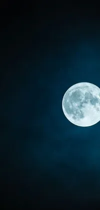 Download this beautiful live wallpaper featuring a shining moon in a dark and starry sky