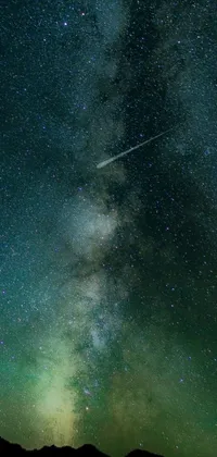 This phone live wallpaper features a stunning ultrawide landscape of the Milky Way galaxy shining brightly against a green and infinite night sky