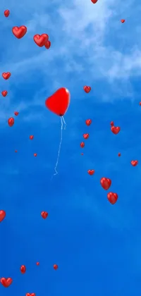 This stunning live wallpaper features a vibrant red balloon soaring freely through a serene blue sky