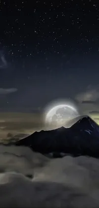 This live wallpaper showcases a beautiful mountain landscape at night, featuring a stunning full moon in the sky