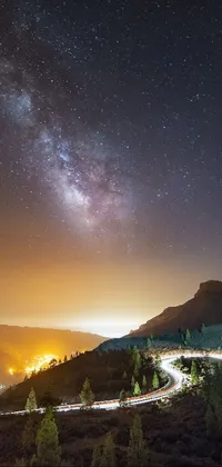 This stunning live wallpaper features a night sky filled with twinkling stars, a serene road between hills and a toxic glowing smog
