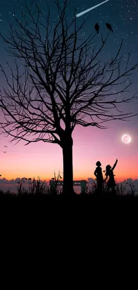 This amazing live wallpaper depicts a romantic and dreamy scene of two individuals standing near a tree under a picturesque pink moon