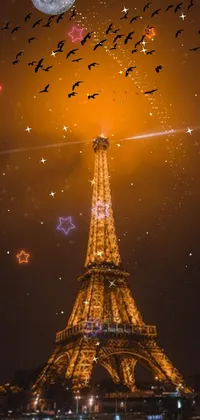 Get mesmerized by the beauty of Paris with this stunning phone live wallpaper featuring the iconic Eiffel Tower at night