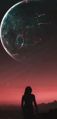 This phone live wallpaper features a captivating image of a confident person standing on a rugged rock with a planet in the backdrop