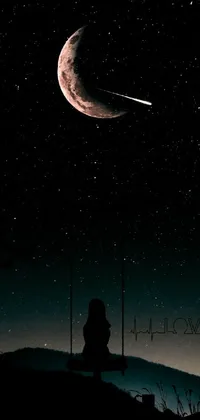 This live phone wallpaper features a breathtaking scene of two individuals sitting atop a hill under a sky filled with stars