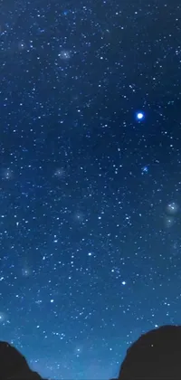 Transform your phone screen into a captivating, starry night sky with this live wallpaper