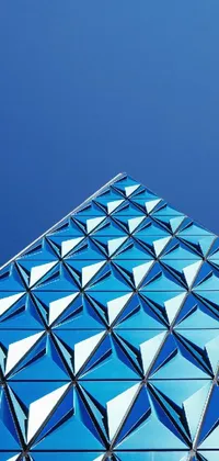 This live wallpaper for your phone showcases a close up of a building against a blue background