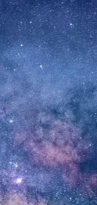 This live wallpaper features a captivating night sky with a multitude of stars shimmering against a dark blue background