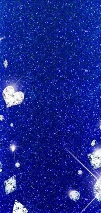 This phone live wallpaper is a stunning blue glitter background with twinkling stars and loveable hearts