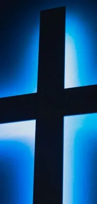 This live phone wallpaper from Unsplash features a striking close-up of a cross on a wall, enhanced with digital art techniques for a modern look