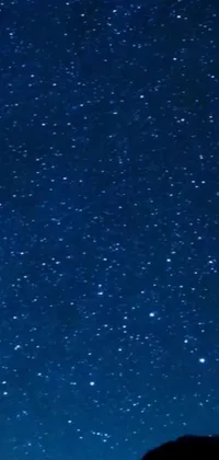 Indulge in the beauty of the night sky with this stunning live wallpaper for your phone