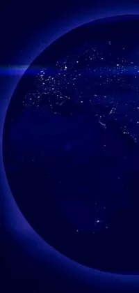 This phone live wallpaper displays a beautiful view of the Earth from space, featuring blue and purple lighting to create a captivating and serene atmosphere