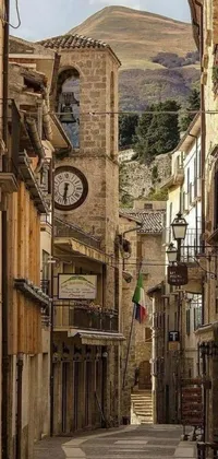 This phone live wallpaper depicts a narrow street in a mountain fortress city, with a clock tower in the background