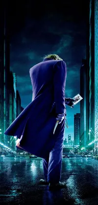 This mobile wallpaper captures a scene from the movie "The Dark Knight", displaying a man in a striking purple suit walking down a busy urban street