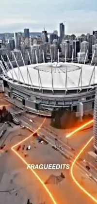 This phone live wallpaper showcases a large stadium located in the heart of a busy city