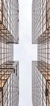 This phone live wallpaper showcases a group of tall, modernist buildings standing next to each other in perfect symmetry