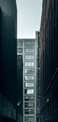 This phone live wallpaper showcases a digital art visual of a couple walking in a dark alley, enclosed by tall, minimalistic buildings