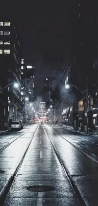 This phone live wallpaper portrays a busy, well-lit city street on a rainy night