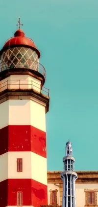 This live phone wallpaper showcases a red and white lighthouse against a blue sky background, featuring vivid hues of turquoise and Venetian red