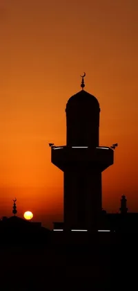 This stunning live phone wallpaper features a serene sunset with a towering structure at its center, surrounded by beautiful mosques and buildings