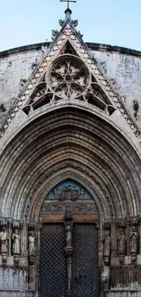 This live phone wallpaper showcases a remarkable image of a stone building with a cross on the top