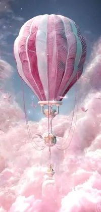 This dreamy phone live wallpaper features a pink hot air balloon soaring through a serene cloud-filled sky