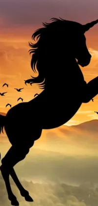 Enjoy this stunning phone live wallpaper featuring a powerful silhouette of a unicorn standing on its hind legs, accompanied by a majestic mustang horse